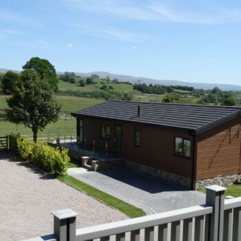 Holiday home with paved driveway and decking