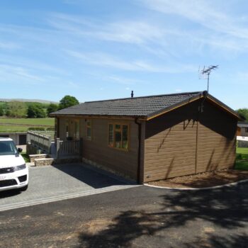 Holiday home with paved driveway and decking