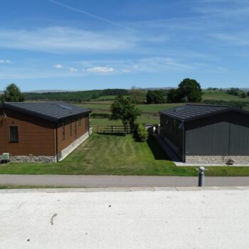 Empty holiday home plot at Moss Bank Lodges