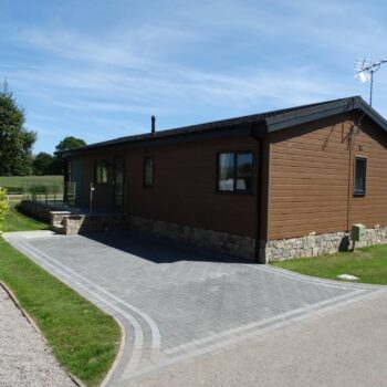 View of holiday home at Moss Bank Lodges